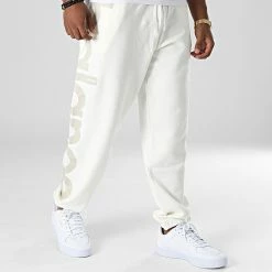 Budget 🤩 Pantalon Jogging UP23503 Beige de New Balance 🛒